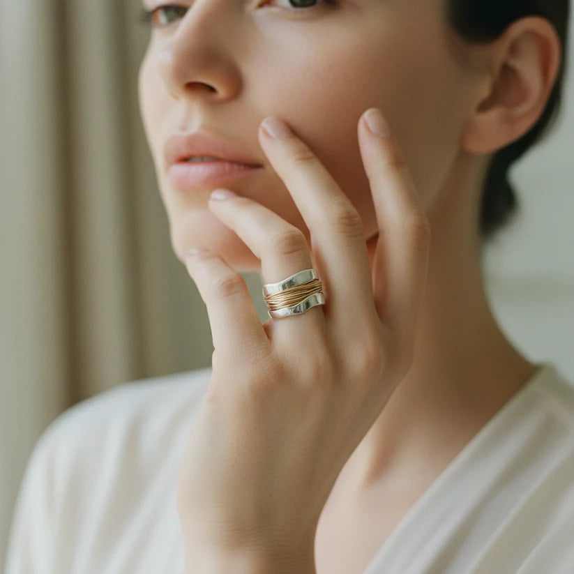 Silver ring with golden threads